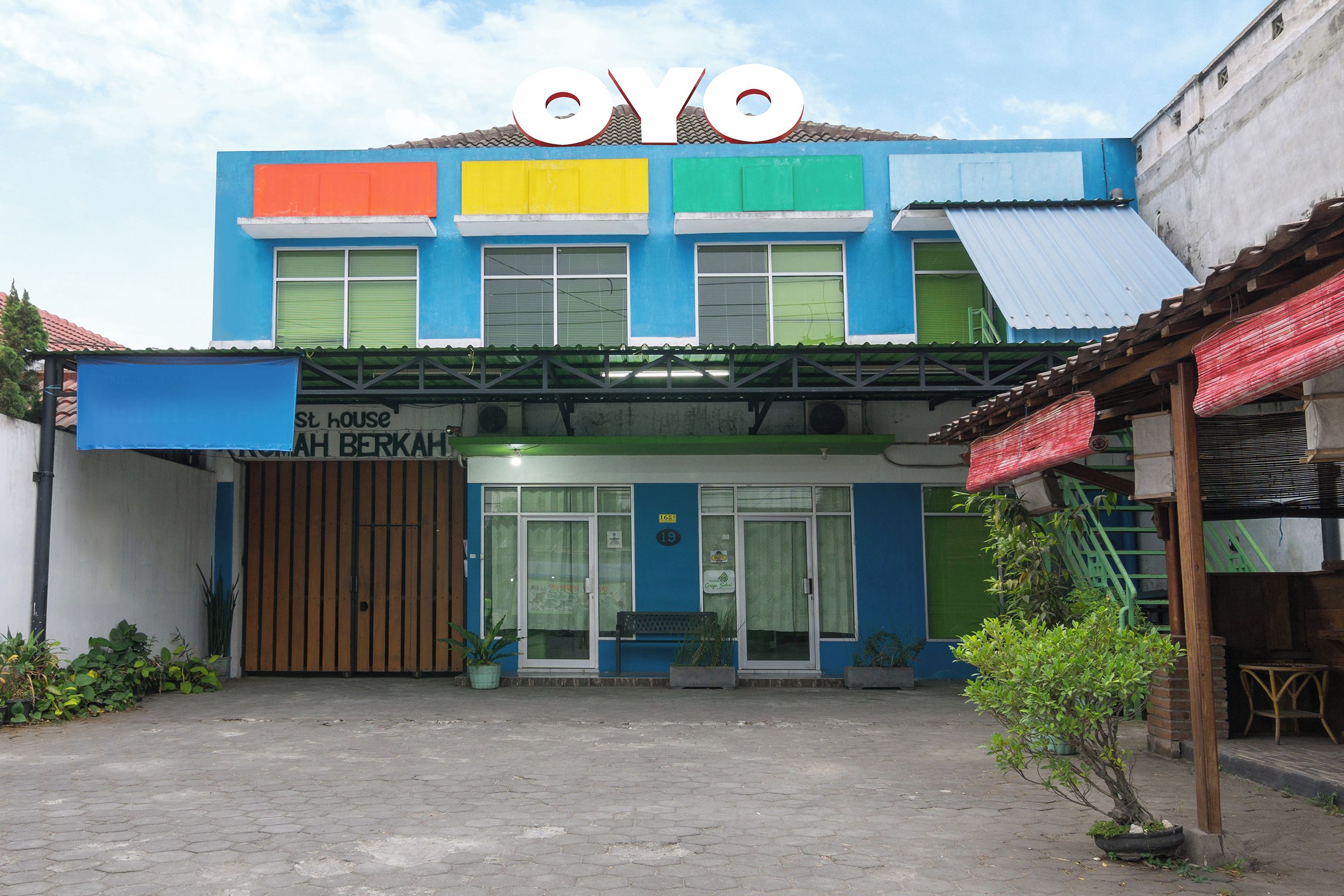 A building with a colorful facade and a sign that reads "OYO".