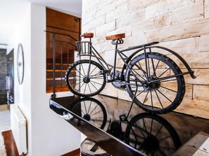 A bicycle mounted on a wall with a wooden panel background. - Villa Enna with heated pool by Interhome (Crno)