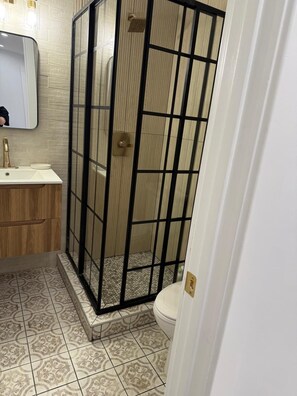 Shower, hair dryer, towels, soap