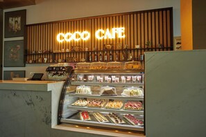 A display case with various pastries and desserts at a cafe. - Secrets Sunny Beach Resort & Spa (Nessebar)