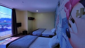 A hotel room with two beds, a window with a view of a cityscape, a wall with a cartoon character mural, and a mounted TV. - Nova Hotel Ipoh by Zuzu (Ipoh)