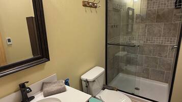 Shower, hair dryer, towels, soap