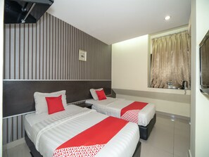 A hotel room with two beds, striped wallpaper, a window with curtains, and a small table with a kettle and cups. - OYO 89965 Stay Inn Ii (Kota Kinabalu)