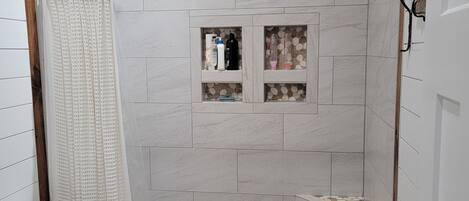 Shower, towels, soap, toilet paper