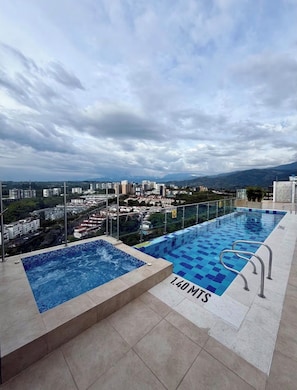 A rooftop pool with a view of a cityscape and mountains. - Cahove9 ; view and location (Armenia)