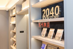 A bookstore interior with shelves, a prominent '2040 BOOKSTORE' sign, and a display of books. - Ji Hotel Shanghai Xujiahui Caobao Road Subway Stat (Shanghai)