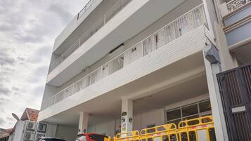 A multi-story building with a parking garage.