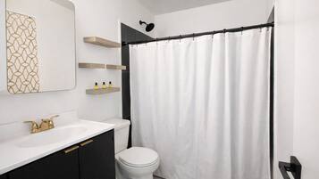 Shower, towels, soap, toilet paper