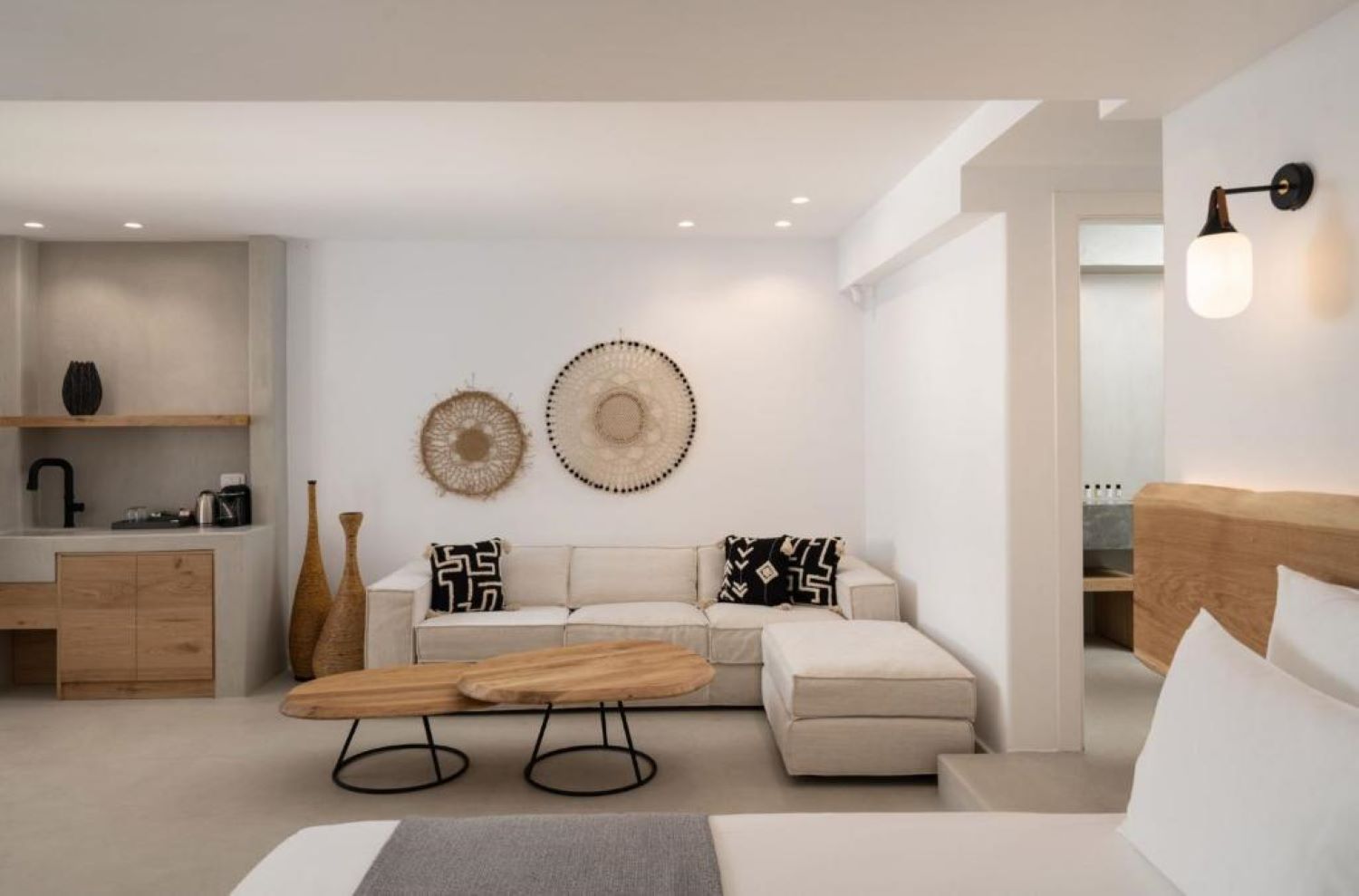 A modern living room with a sofa, coffee table, and decorative wall art.