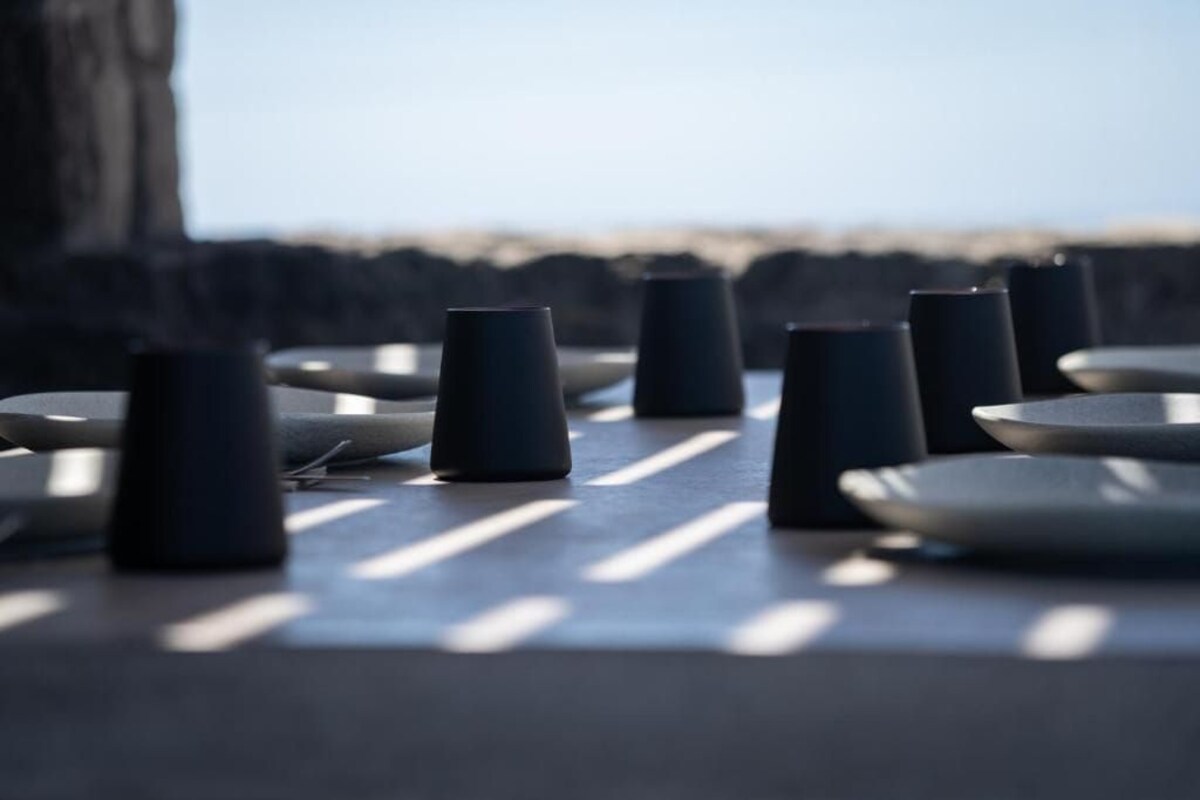 A series of black and white objects arranged in a line, possibly a part of a table or counter.