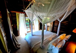 A room with a bed, a ceiling fan, and a window with curtains. - Ocean Bay Resort & Spa Phu Quoc (Phu Quoc)
