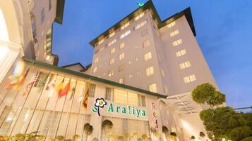A hotel with a prominent sign reading 'Araliya Red.'
