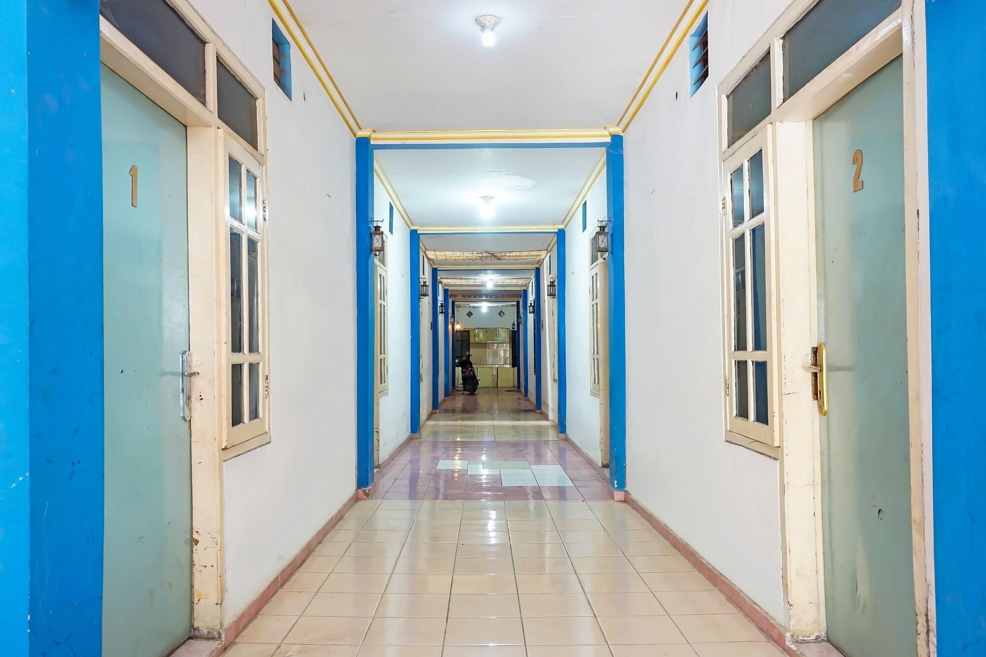 A corridor with doors numbered 1 and 2, leading to rooms.