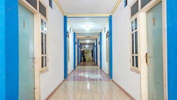 A corridor with doors numbered 1 and 2, leading to rooms.