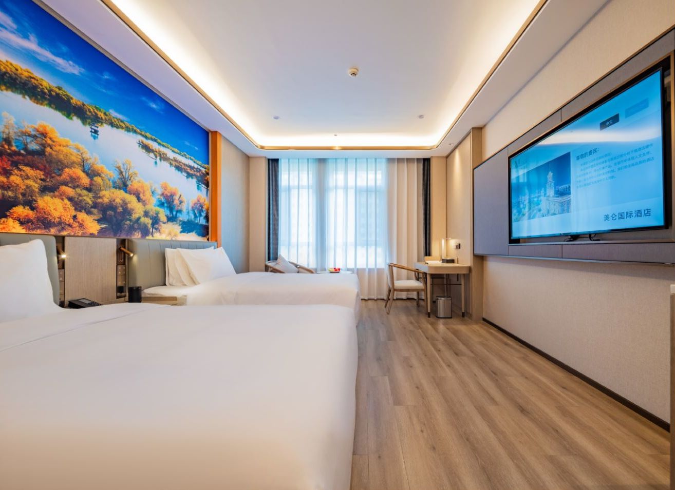 A hotel room with two beds, a desk, a chair, a television, and a large window with curtains.