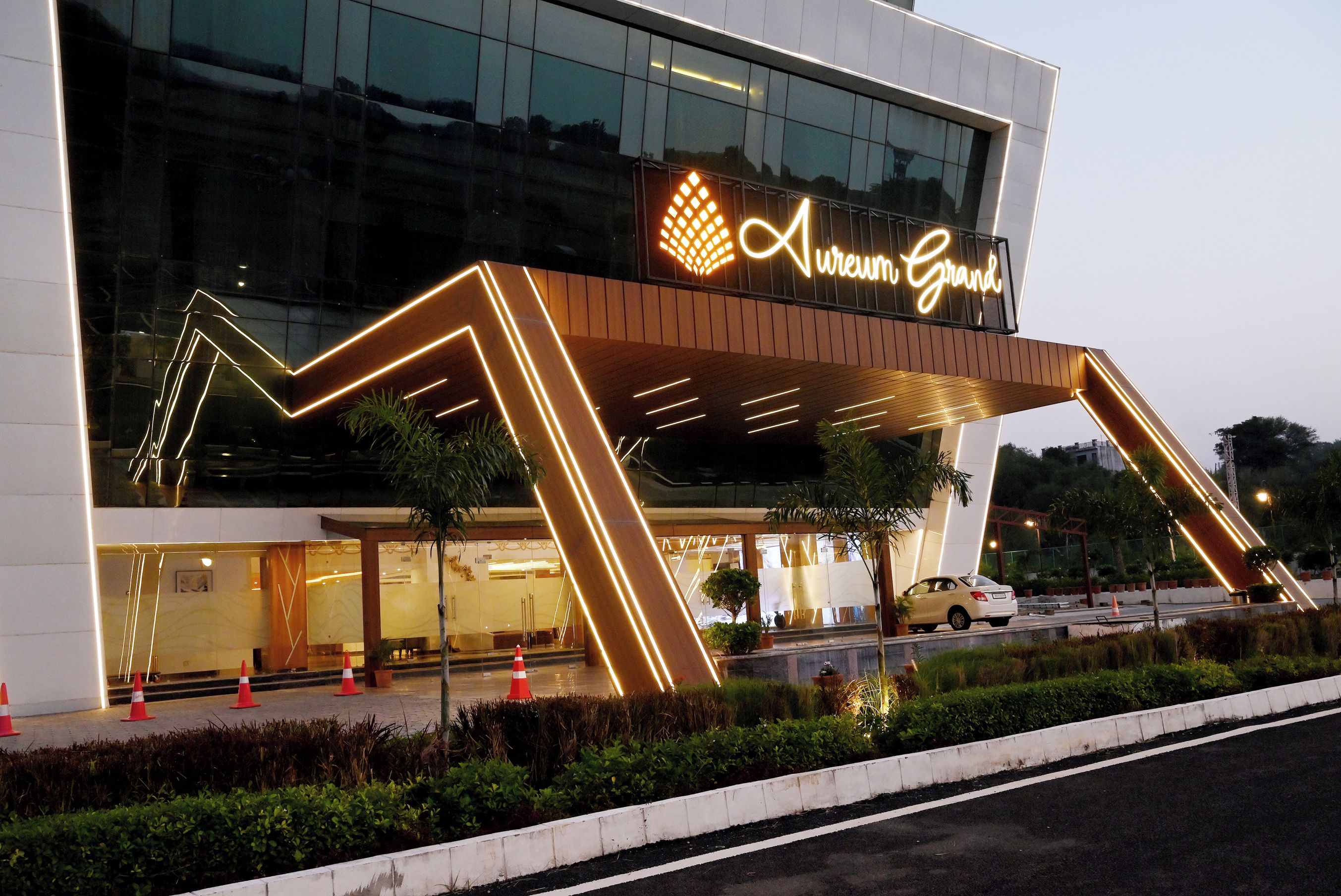 A modern building with a prominent sign reading 'Aureum Grand.'