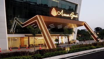 A modern building with a prominent sign reading 'Aureum Grand.'