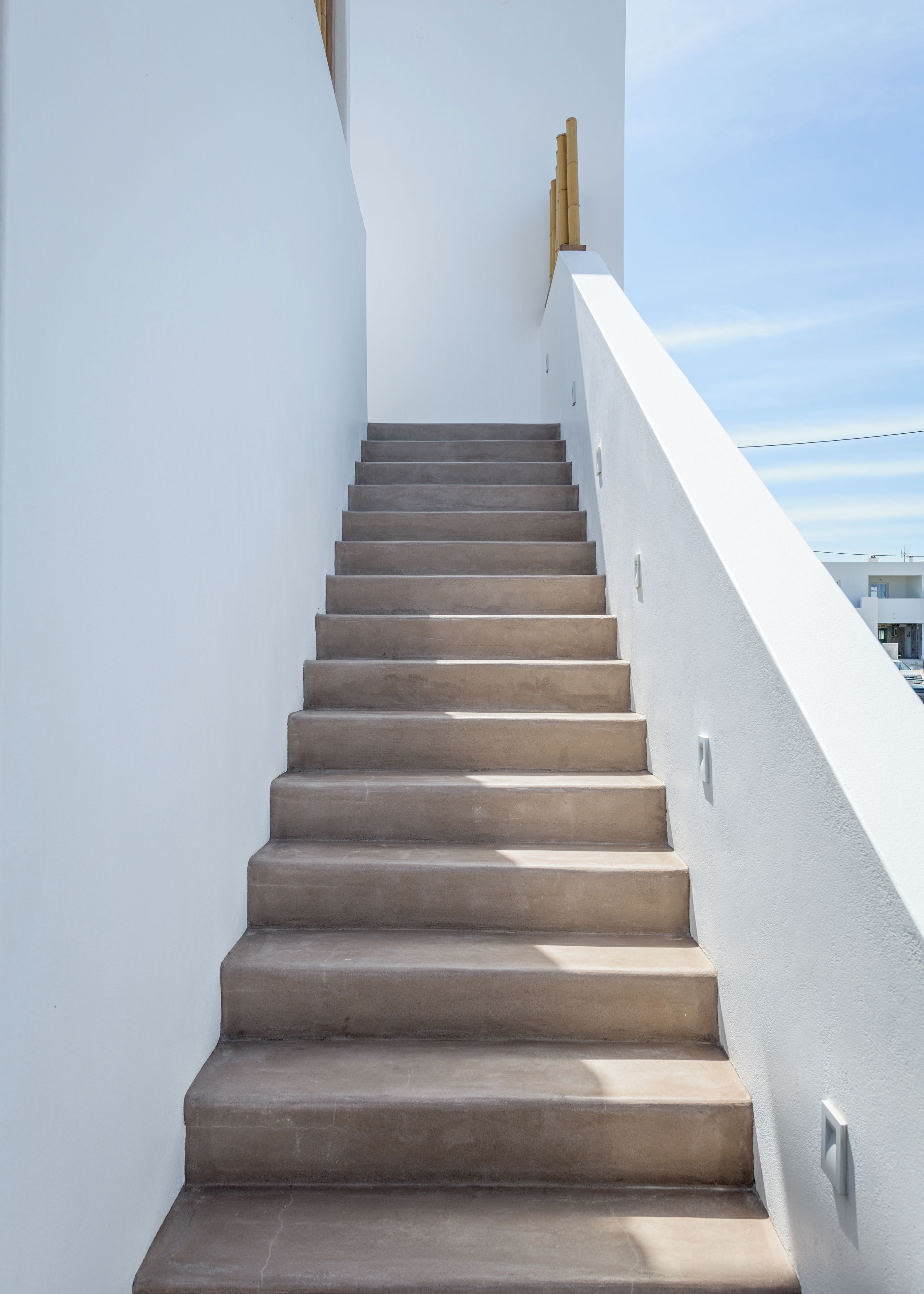 A staircase with a modern design, leading upwards.