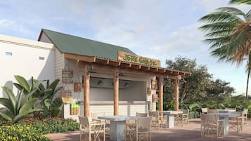 Un restaurante con terraza, techo verde y un letrero que dice 'Jerk Shack'.