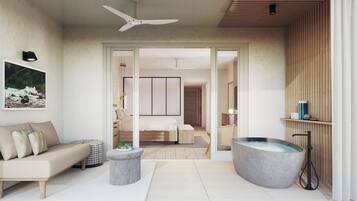 Un dormitorio moderno con cama, zona de estar con sofá, bañera grande y ventilador de techo.