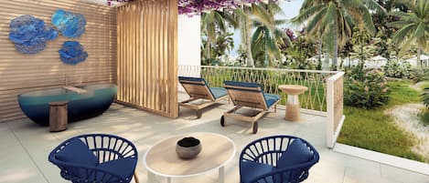 A sunlit outdoor seating area with a pool, lounge chairs, and a table.