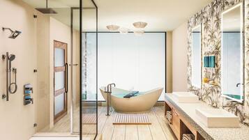 A modern bathroom with a freestanding bathtub, a glass shower enclosure, and a large mirror.