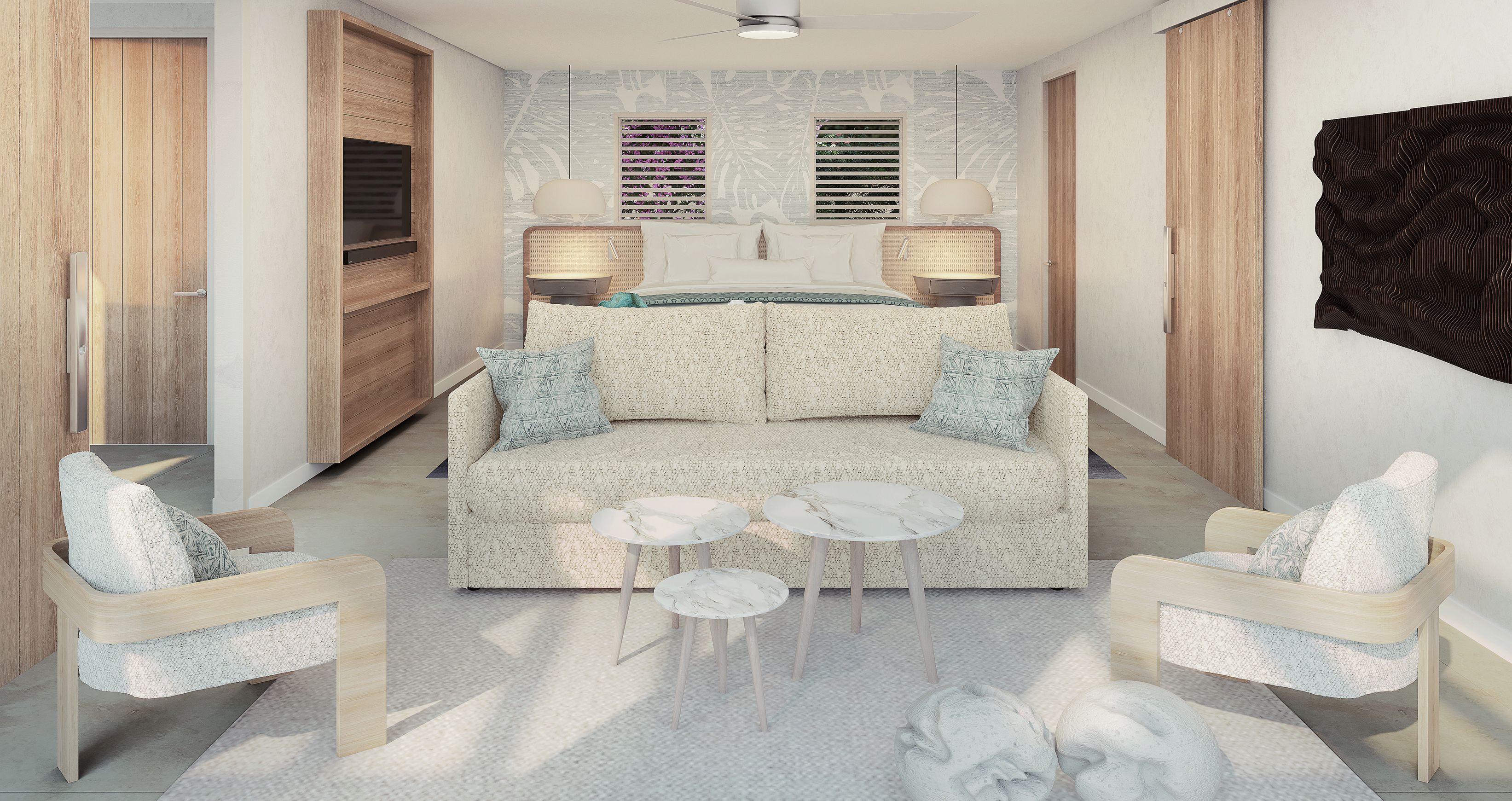 Un dormitorio moderno con sofá, dos mesitas auxiliares, cama con cabecero y armario.