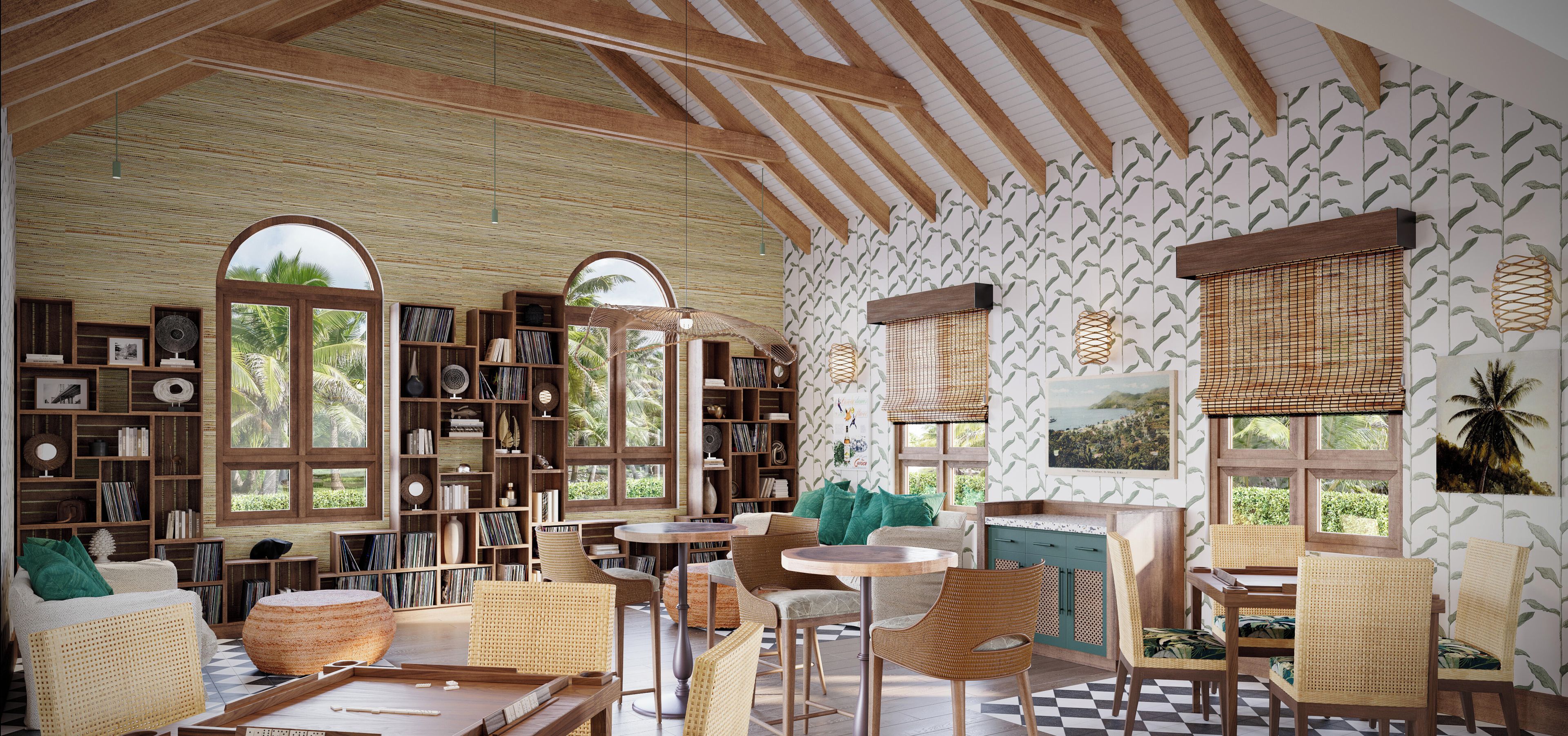 Ein Zimmer mit hohen Decken, Holzbalken und großen Fenstern mit tropischem Wandpapier. Es gibt Bücherregale, Korbmöbel und einen Blick auf Palmen.