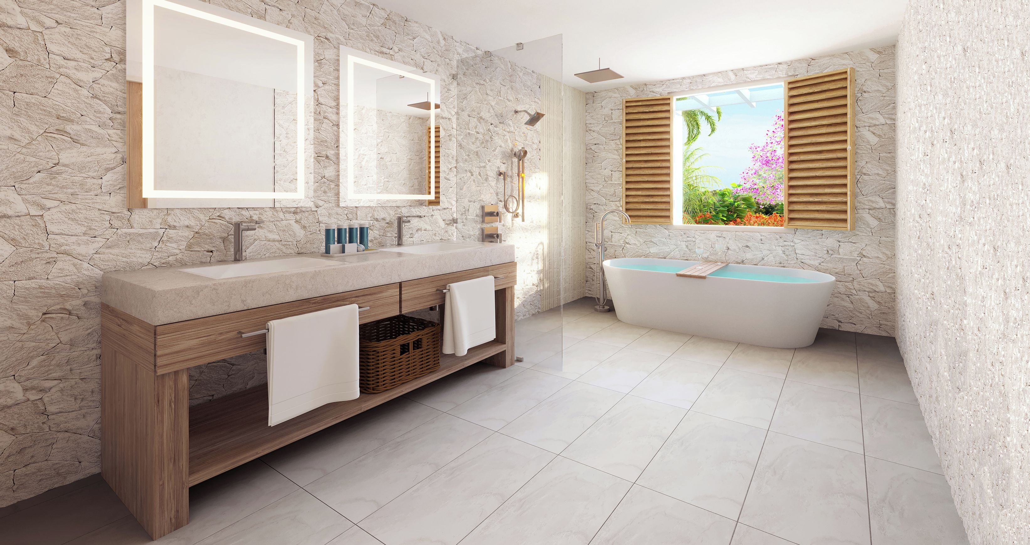 Un baño con pared de piedra, tocador de madera, bañera y ventana con vistas a flores.
