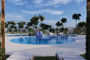 A swimming pool with a circular design, surrounded by palm trees and lounge chairs. - Delta Hotels Marriott, Dar es Salaam (Dar es Salaam)