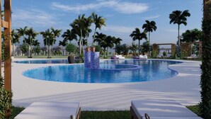 A swimming pool with a circular design, surrounded by palm trees and lounge chairs. - Delta Hotels Marriott, Dar es Salaam (Dar es Salaam)