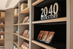 A bookstore with shelves and a sign reading '2040 BOOKSTORE'.