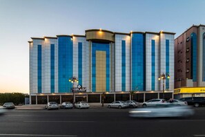 A hotel with a modern facade, multiple floors, and a prominent entrance. - Enala Tabuk Hotel (Tabuk)