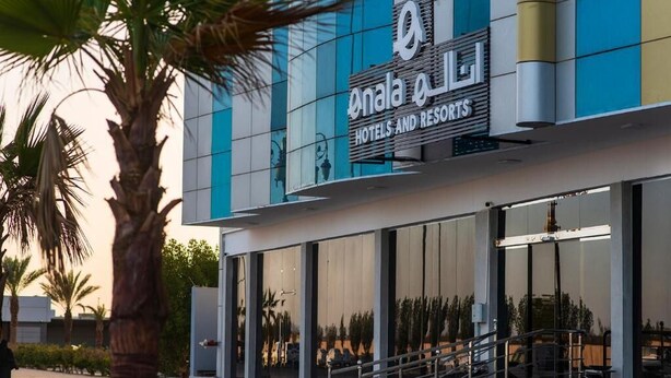 A modern hotel building with a prominent sign for 'Onala Hotels and Resorts.' - Enala Tabuk Hotel (Tabuk)