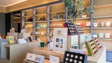 A bookstore with shelves of books and a display of coffee beans.