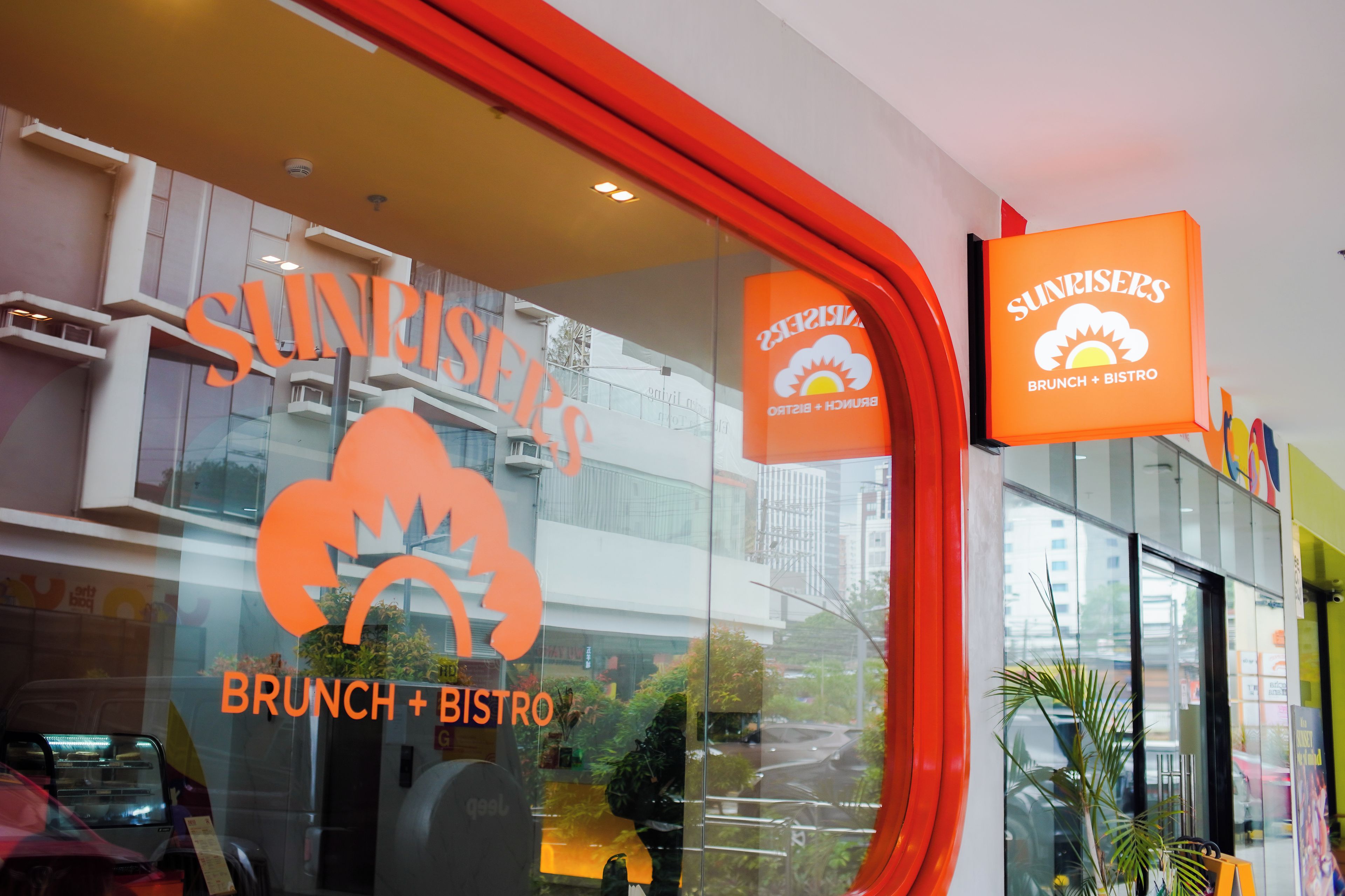 A restaurant named 'Sunrisers' with a 'BRUNCH + BISTRO' sign.