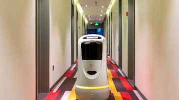 A hallway with a self-service luggage cart.