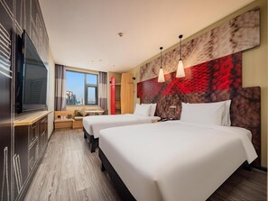 A hotel room with two beds, a TV, a window with a city view, and a red abstract wall art piece. - Ibis Chengdu Kuanzhai Alley Center Hotel (Chengdu)