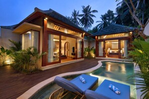 A resort with a swimming pool, wooden deck, and glass-enclosed rooms. - Asvara Luxury Resort Ubud By Ini Vie hospitality (Payangan)