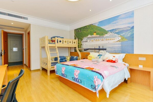 A child's bedroom with bunk beds, a bed with a pink blanket, and a mural of a cruise ship.
