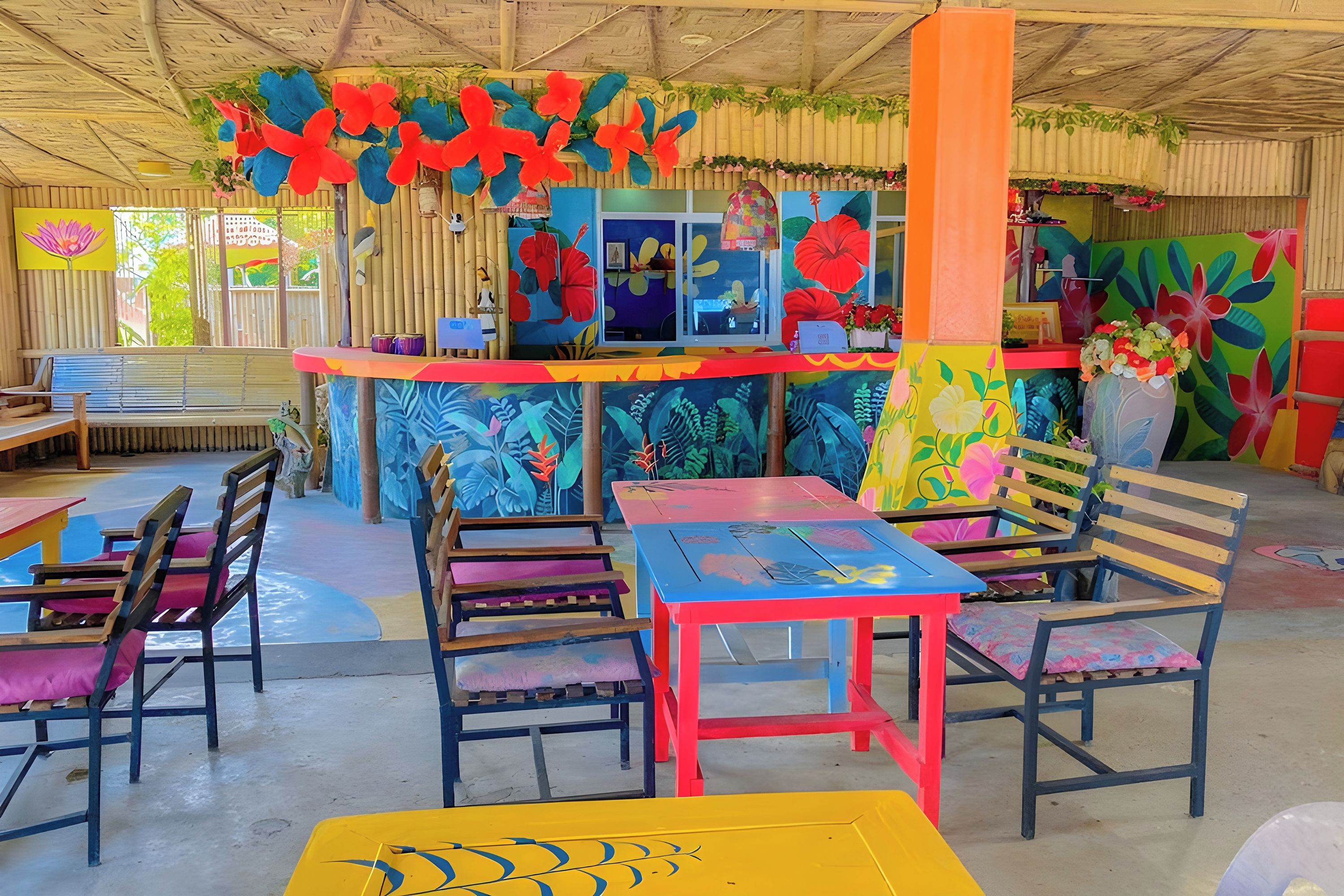 A colorful indoor space with a counter, chairs, and tables.