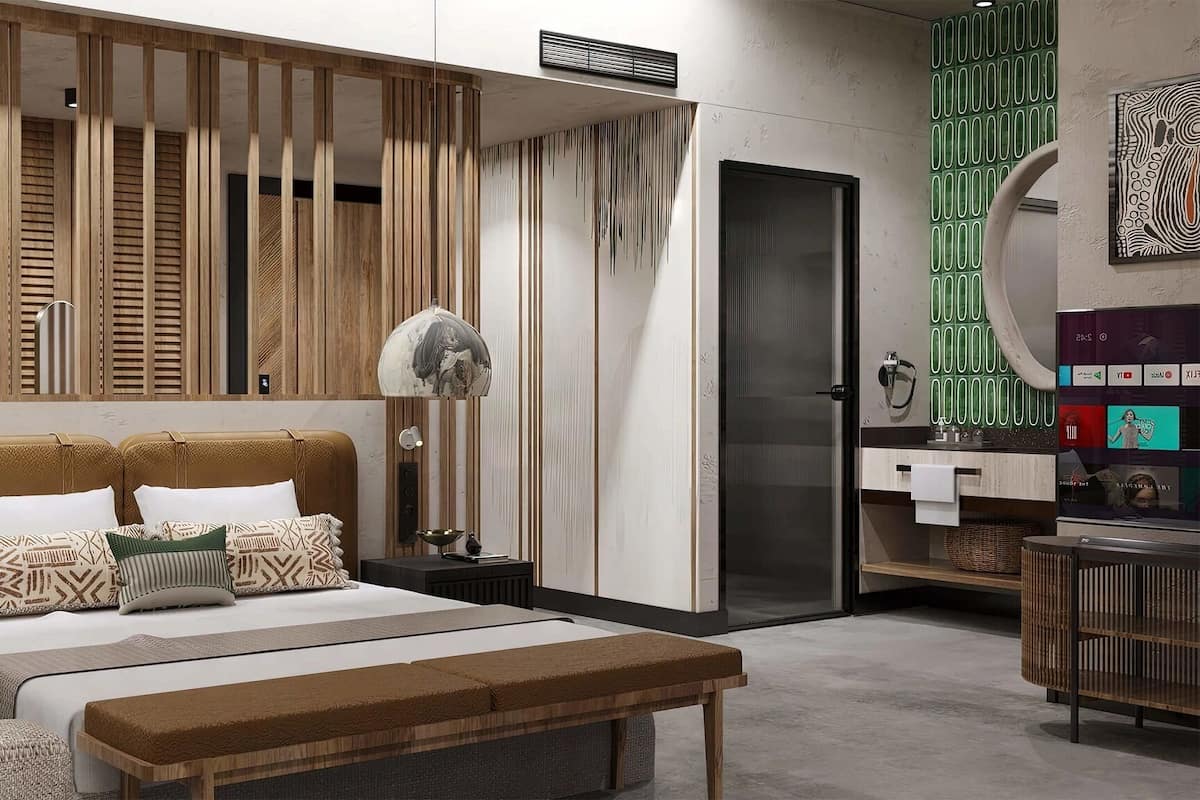 A modern bedroom with a bed, bedside tables, a bench, and a wardrobe.