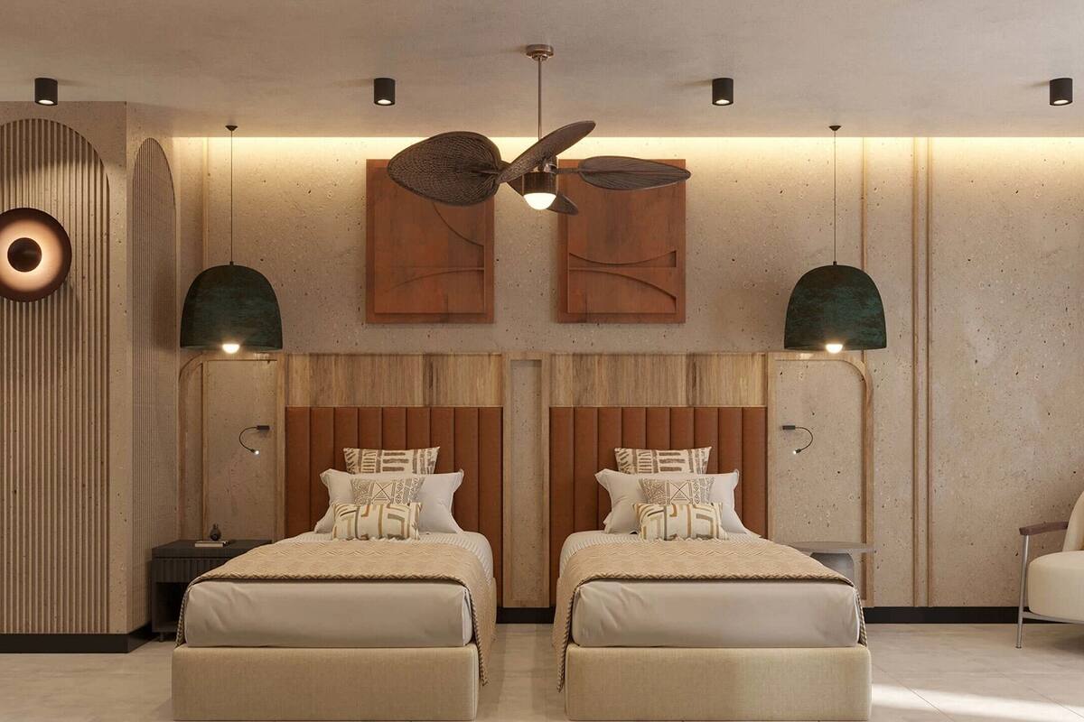 A modern bedroom with two beds, a ceiling fan, and a unique circular light fixture.