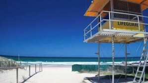A lifeguard tower with a clear view of the ocean and beach. - The Phoenician Luxe Suite (Broadbeach)