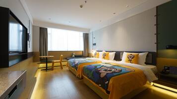 A hotel room with a large bed, a desk, a chair, a TV, and a window.