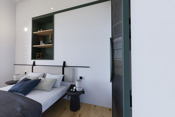A modern bedroom with a bed, bedside tables, a nightstand, a mirror, and a built-in shelf with decorative items. - Kentrikon 1924 Boutique Hotel And Suites (Paphos)