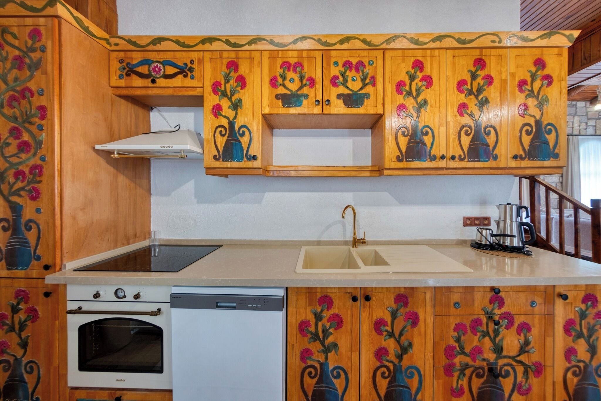 A kitchen with wooden cabinets, a sink, a stove, and a dishwasher.