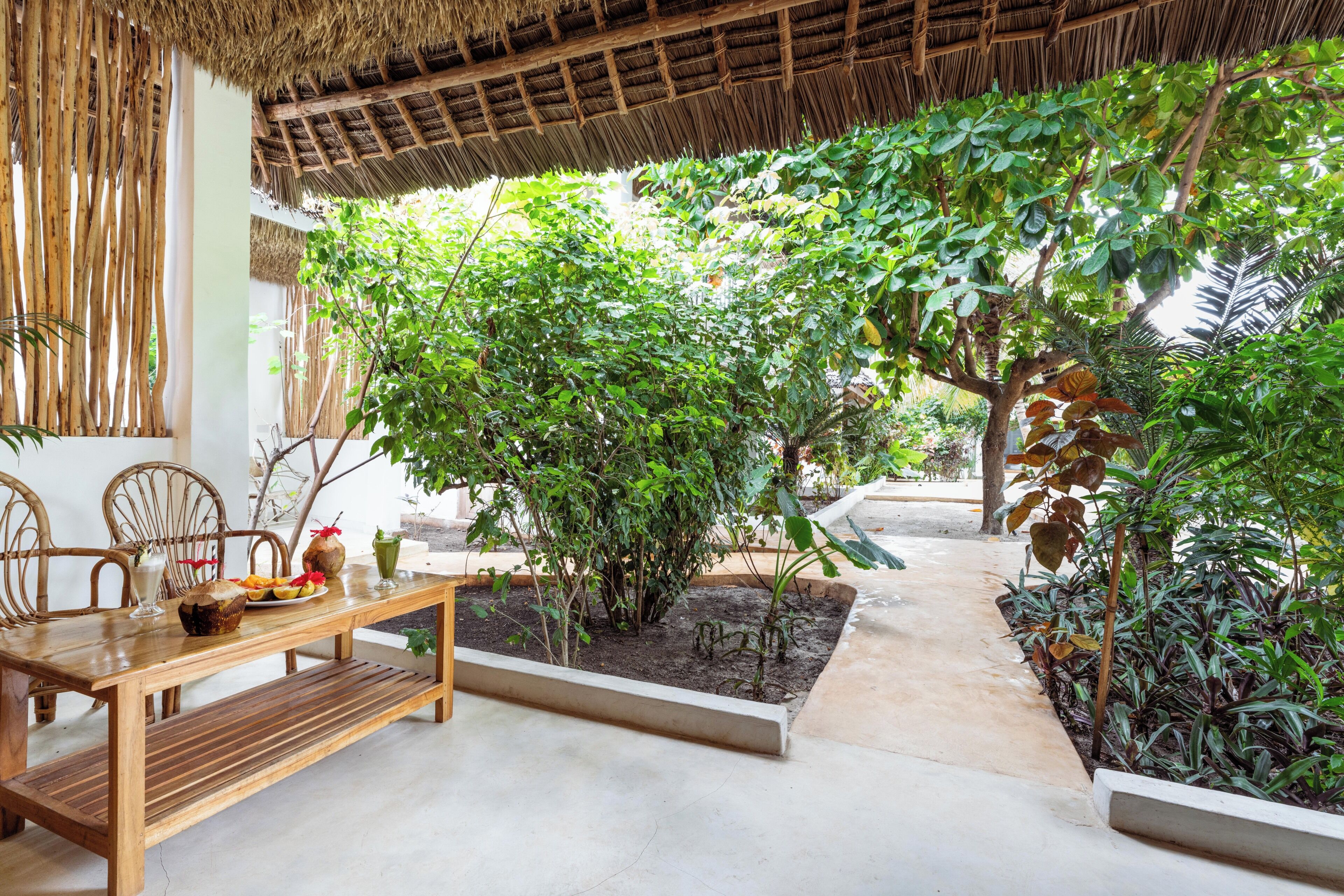 Bungalow Deluxe, vista al jardín | Restaurante al aire libre