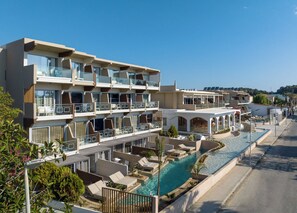 A multi-story hotel with balconies, a swimming pool, and a view of the sea. - Kolymbia Bay Art Adults Only Boutique Hotel (Rhodes)