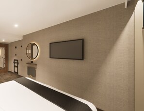 A modern hotel room with a large bed, a flat-screen TV, a round mirror, and a small seating area. - Point A Hotel Edinburgh, St Andrew Square (Edinburgh)